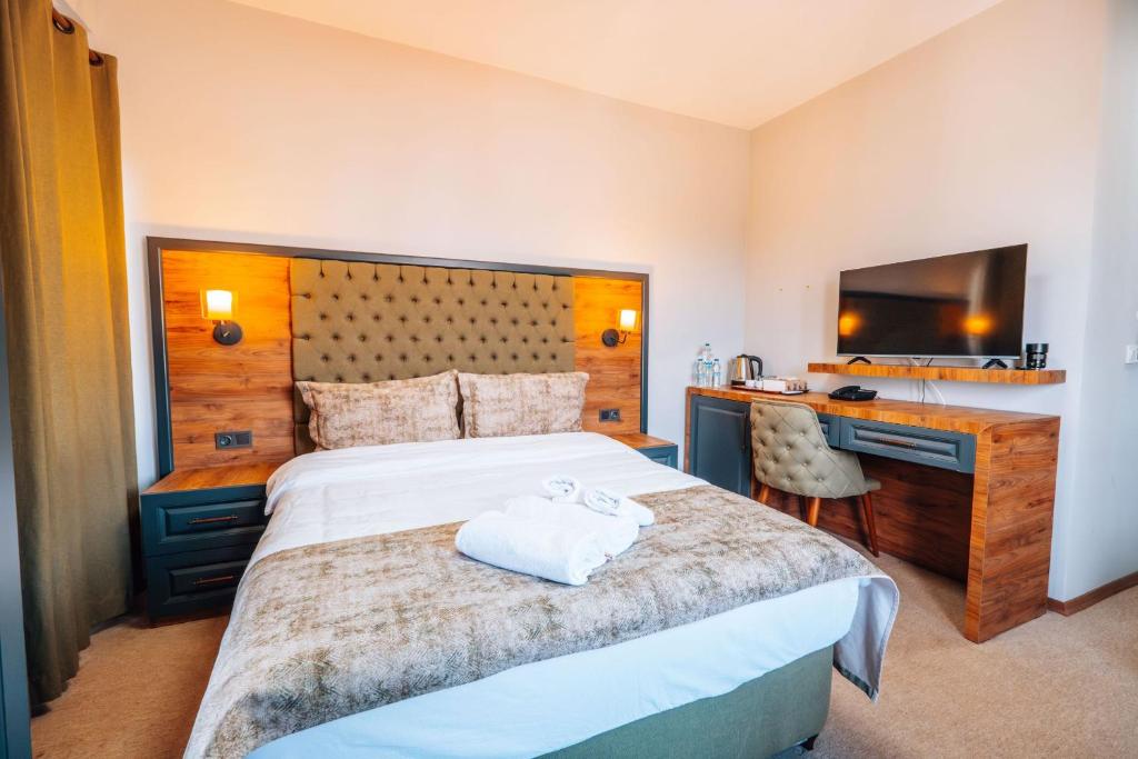 Postel nebo postele na pokoji v ubytování Mysia Olympos Hotel