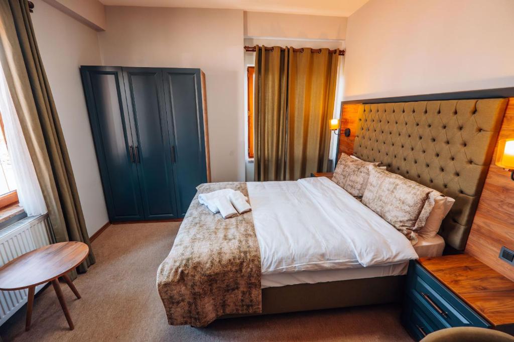 Postel nebo postele na pokoji v ubytování Mysia Olympos Hotel