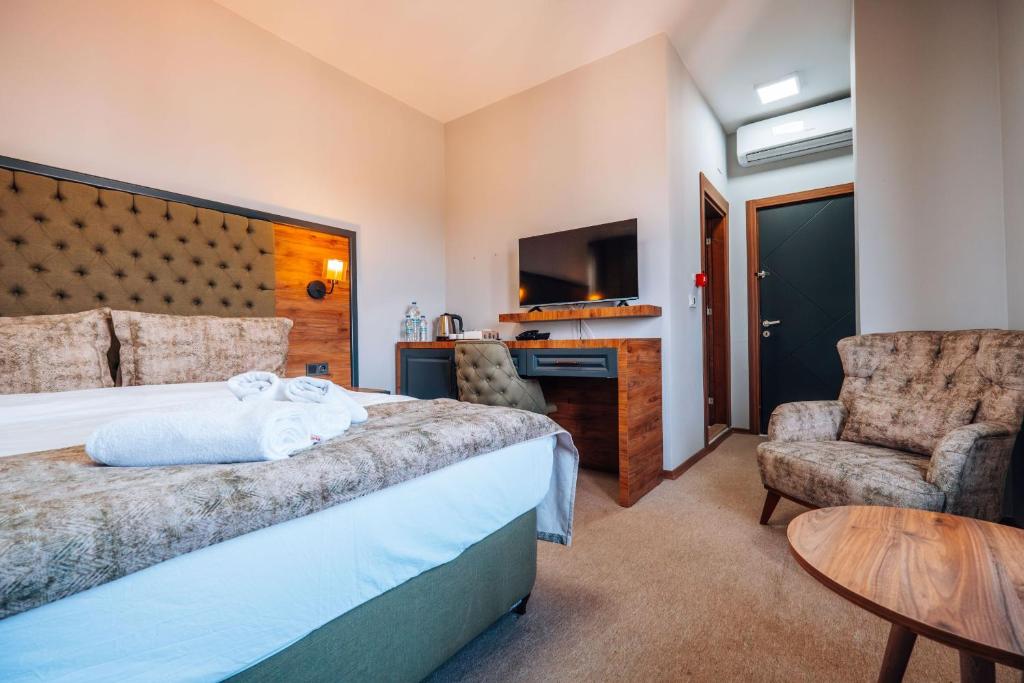Postel nebo postele na pokoji v ubytování Mysia Olympos Hotel