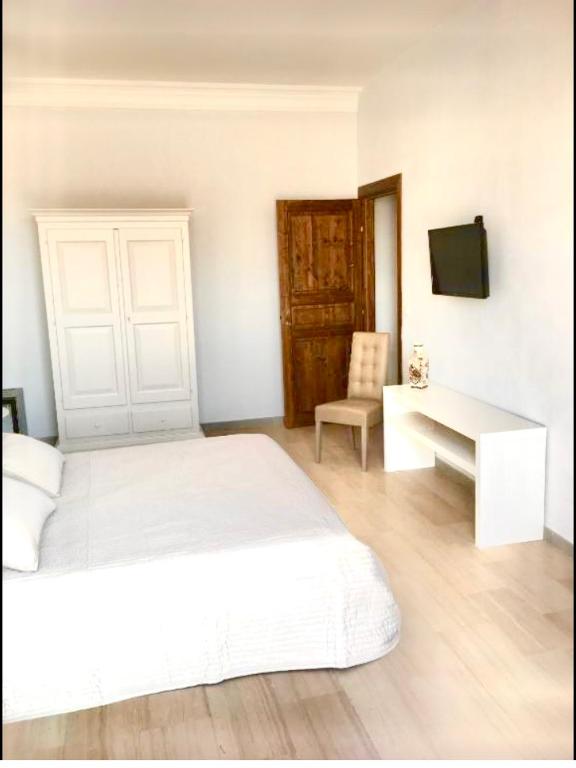 Postel nebo postele na pokoji v ubytování Simonetta's Rooms