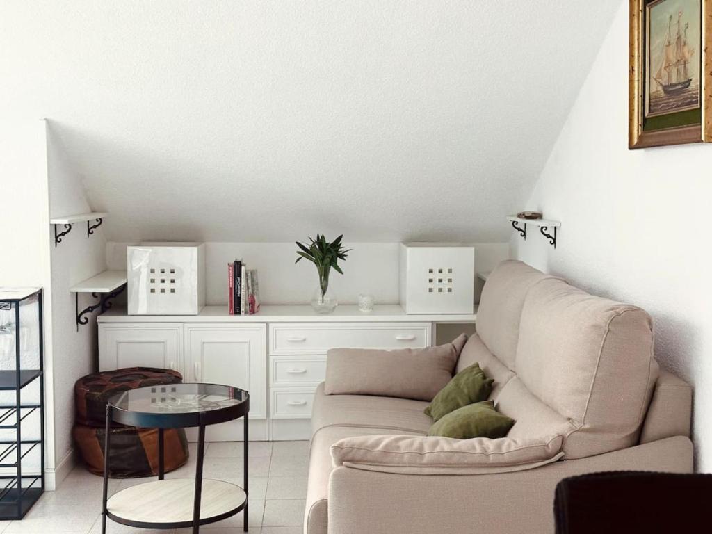 a living room with a couch and a table at El Solsticio - 30601 in Somo