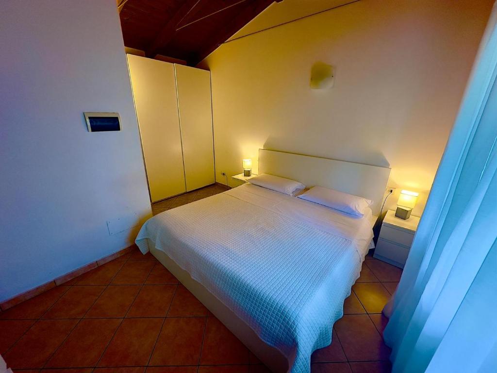 Postel nebo postele na pokoji v ubytování Hotel Casa Piantoni