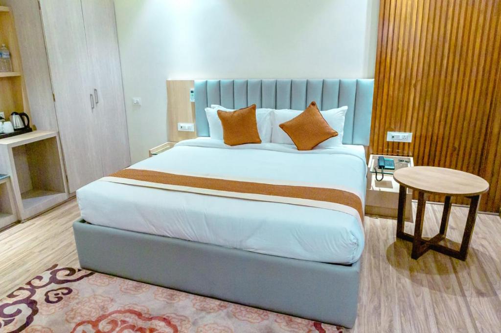 Postelja oz. postelje v sobi nastanitve Hotel Badrinath