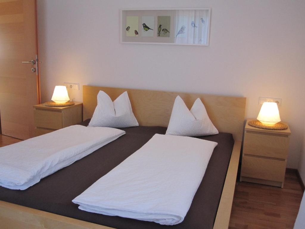 En eller flere senge i et værelse på Ferienwohnung Bergpanorama