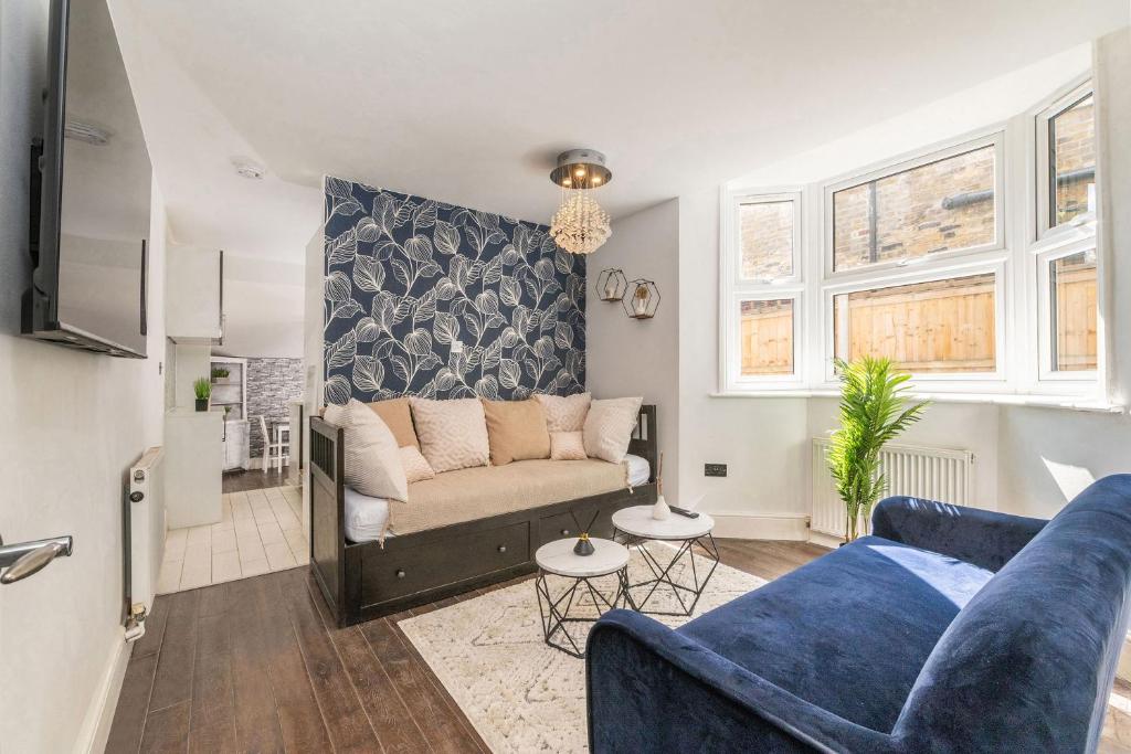 a living room with a couch and a table at London Apartment Near The London Eye in London