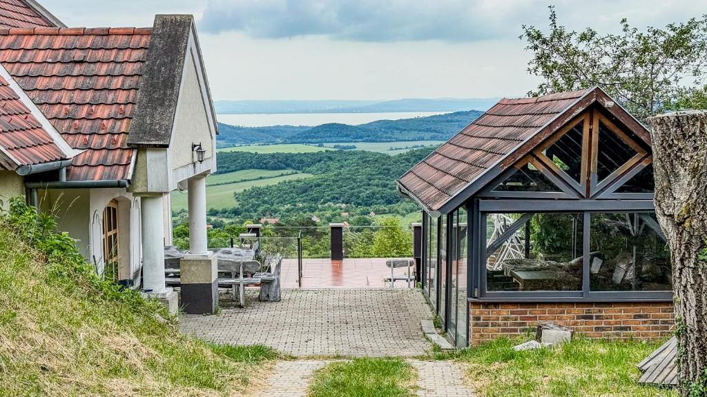 a house with a view of the countryside at Borospince Vendégház in Pécsely