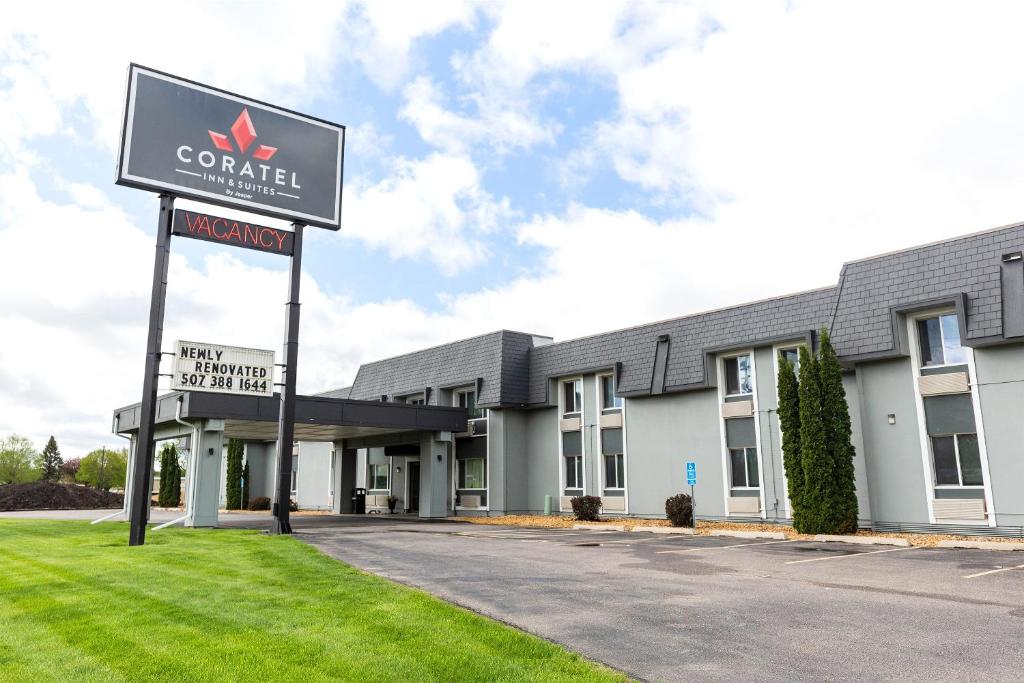 a building with a sign in front of it at Coratel Inn & Suites by Jasper Mankato in Mankato
