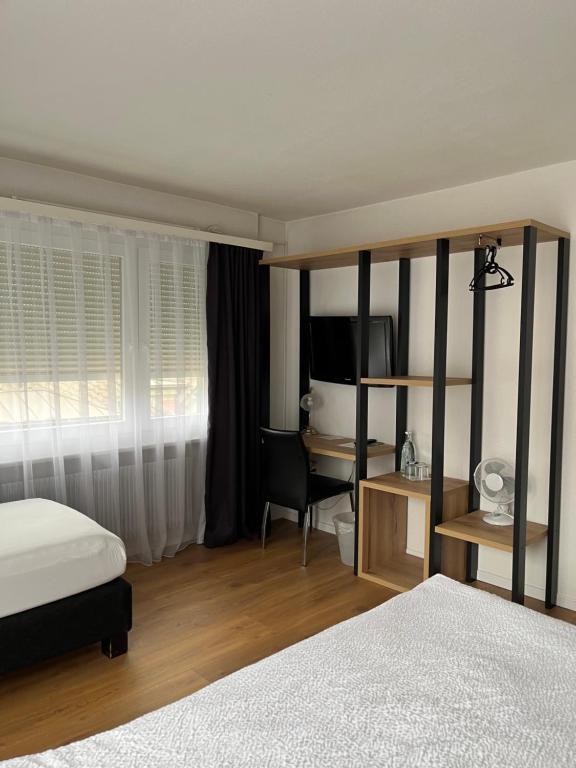 Postel nebo postele na pokoji v ubytování Hotel Europe Brig