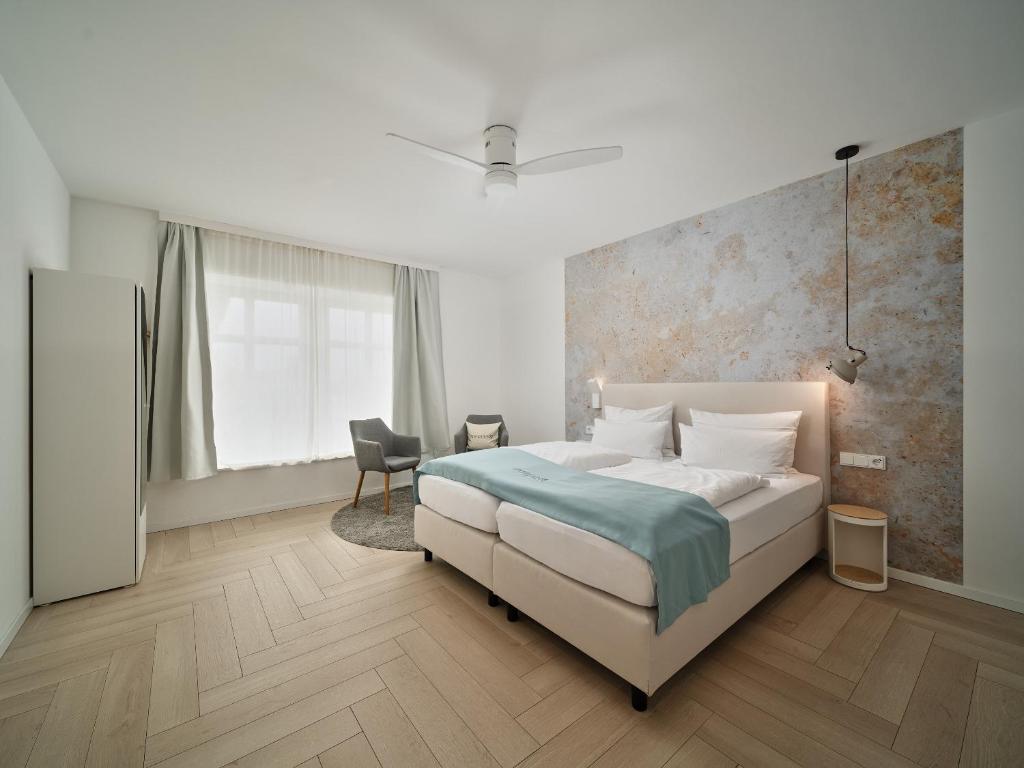 Postel nebo postele na pokoji v ubytování Hotel Siebzehn80