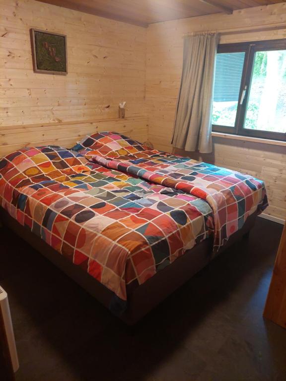 Postel nebo postele na pokoji v ubytování Chalet 7 - volledig gerenoveerd