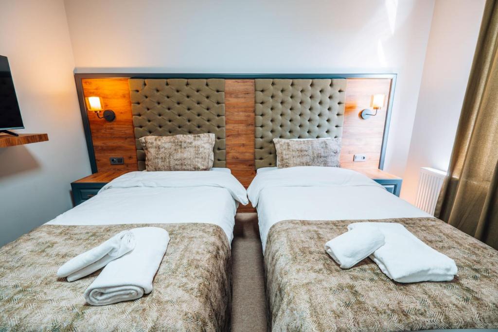Postel nebo postele na pokoji v ubytování Mysia Olympos Hotel