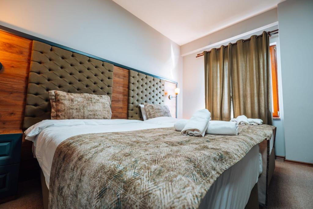 Postel nebo postele na pokoji v ubytování Mysia Olympos Hotel