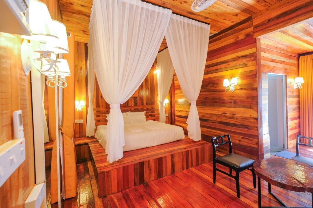 Postel nebo postele na pokoji v ubytování Woodcookies Guesthouse