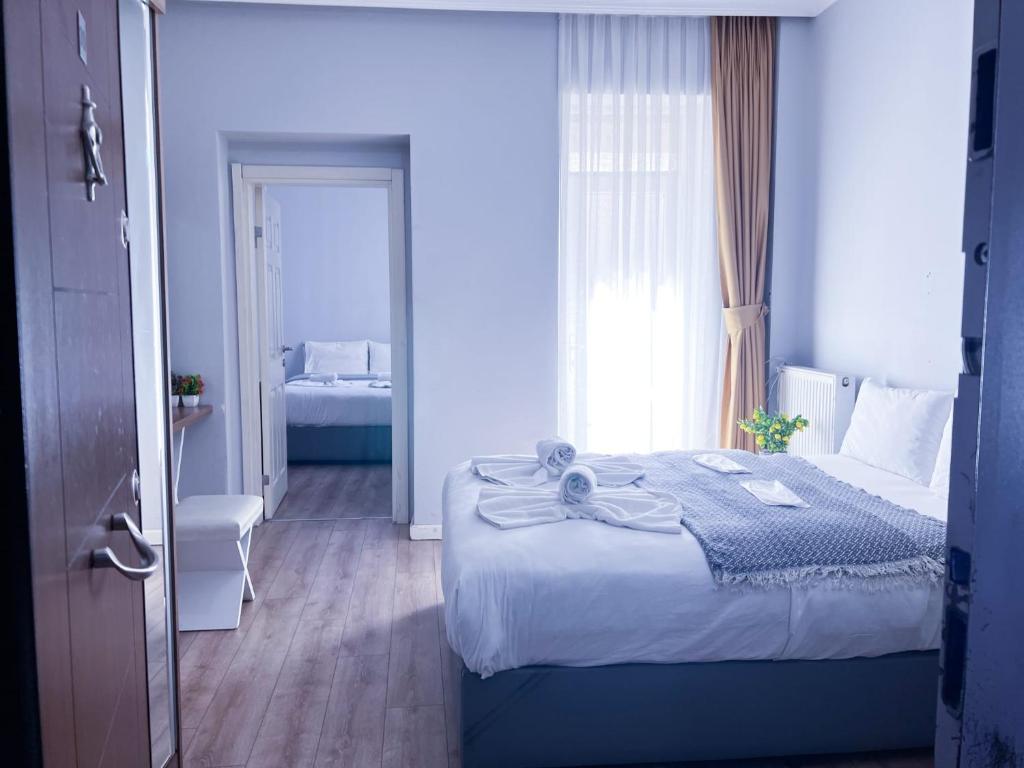 Postel nebo postele na pokoji v ubytování West Taksim suites