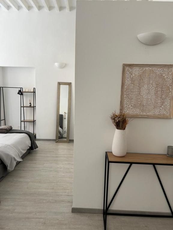 Postel nebo postele na pokoji v ubytování Splendido Loft Centro Storico Parma