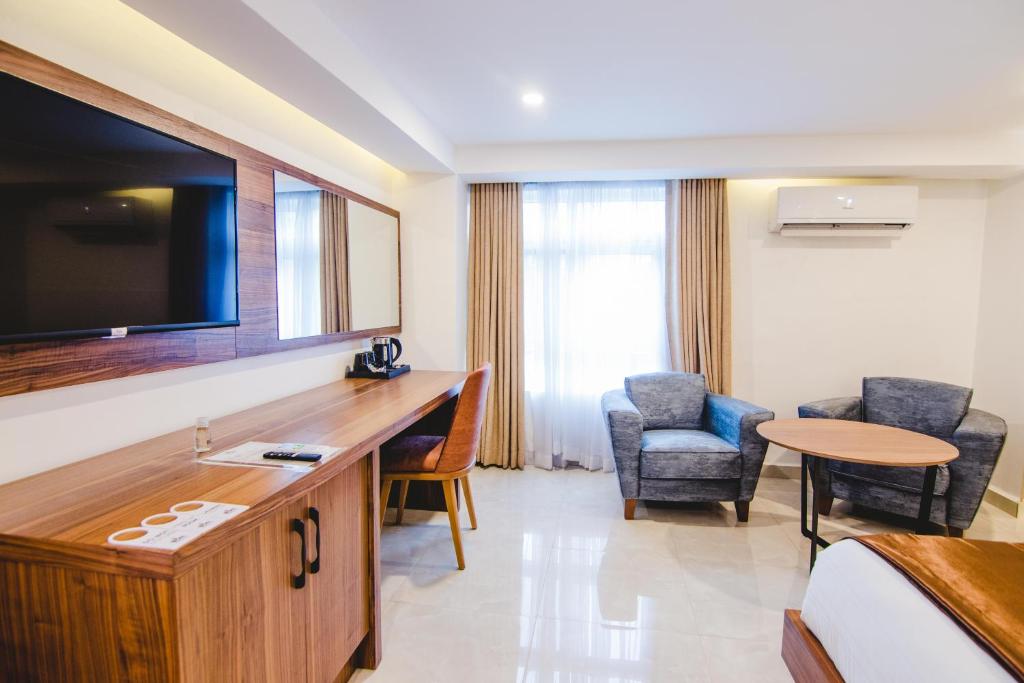 TV a/nebo společenská místnost v ubytování BON Hotel Imperial