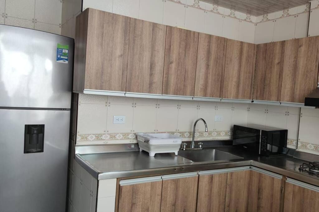Kuchyň nebo kuchyňský kout v ubytování Acogedor apartamento Barrio Gamma 2