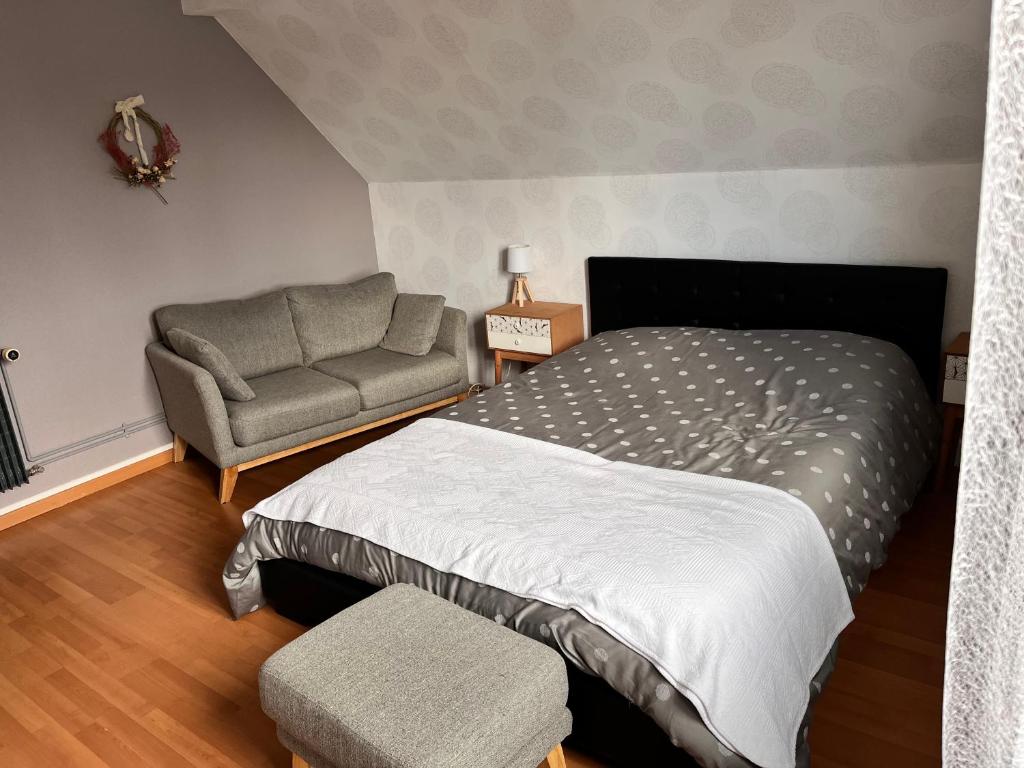Postel nebo postele na pokoji v ubytování JM et Domi