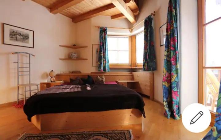 Łóżko lub łóżka w pokoju w obiekcie Dolomiti Homestay