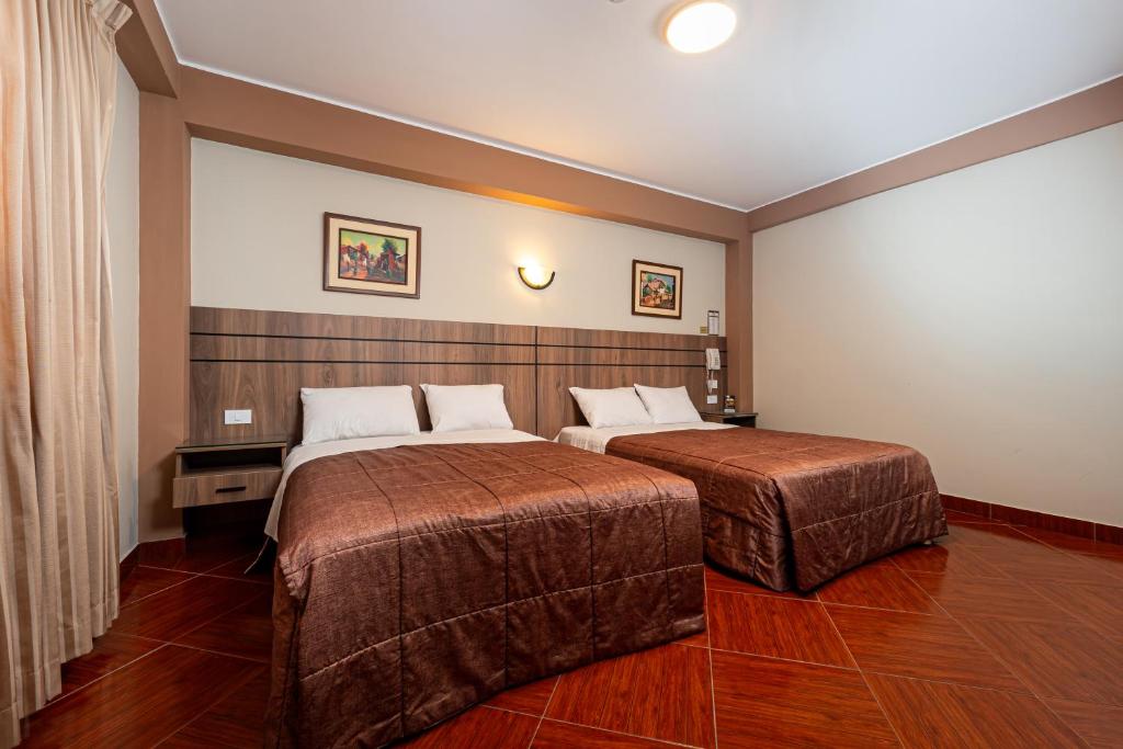 Postel nebo postele na pokoji v ubytování Hotel Bohemia