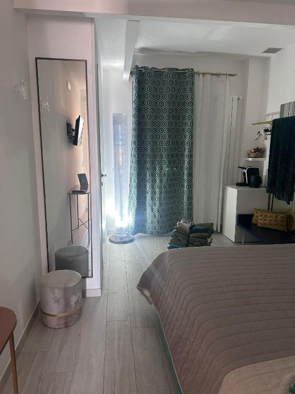 Postel nebo postele na pokoji v ubytování Altamarea Rooms