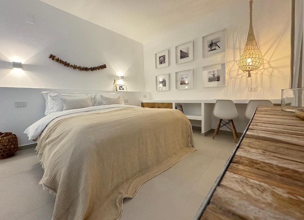 En eller flere senge i et værelse på La Casa Al Mare