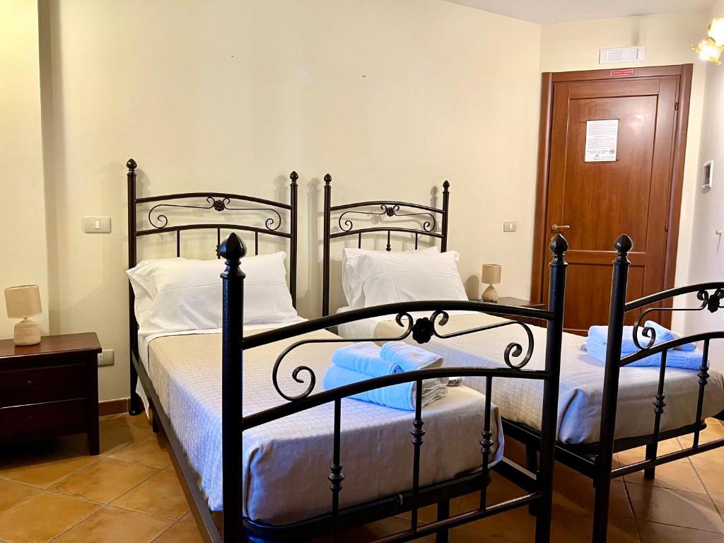 Postel nebo postele na pokoji v ubytování B&B Antico Caricatore