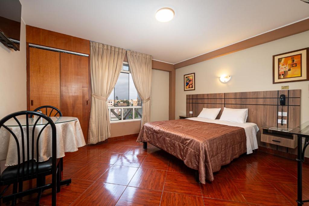 Postel nebo postele na pokoji v ubytování Hotel Bohemia