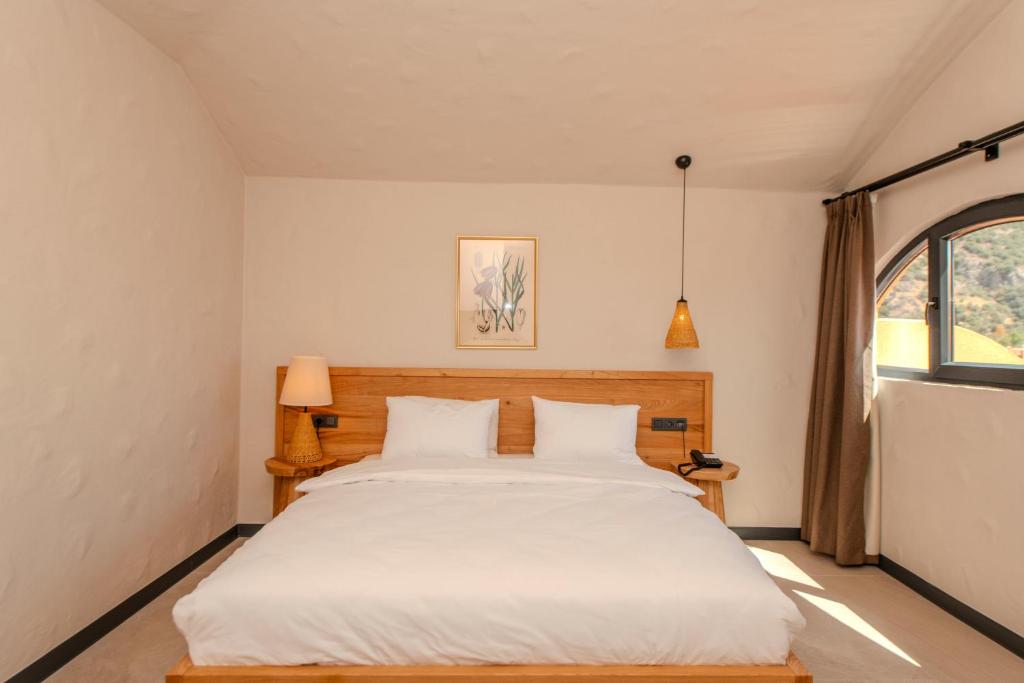 Postel nebo postele na pokoji v ubytování Unsal Hotel