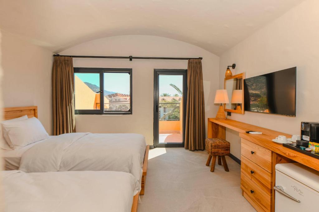 Postel nebo postele na pokoji v ubytování Unsal Hotel