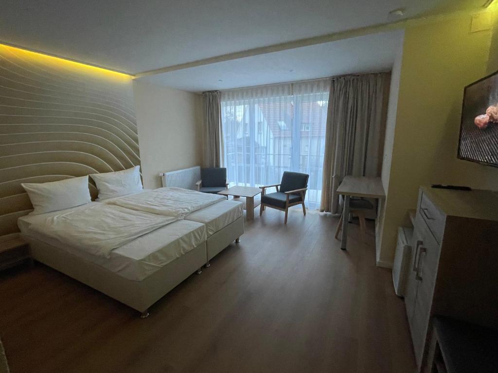 Postel nebo postele na pokoji v ubytování Hotel Andrea