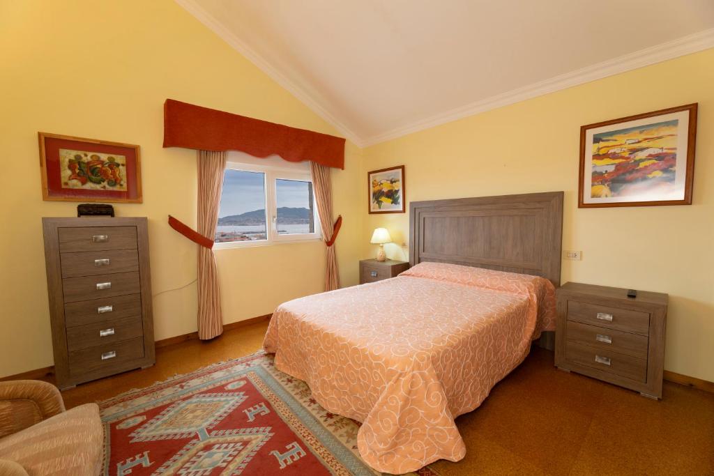 Łóżko lub łóżka w pokoju w obiekcie Casa Vila do mar