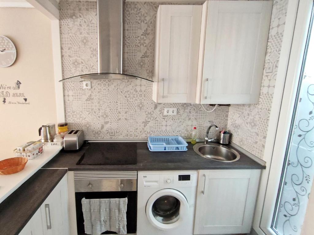 Kuchyň nebo kuchyňský kout v ubytování Serendipia Apartamentos 1