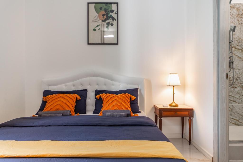 Ένα ή περισσότερα κρεβάτια σε δωμάτιο στο Rosa Rooms