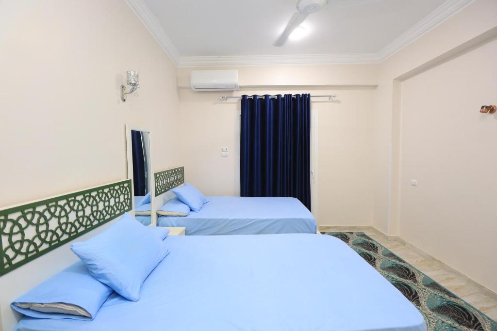 Postel nebo postele na pokoji v ubytování Ramsses Palace