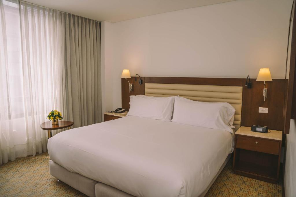 Postel nebo postele na pokoji v ubytování Hotel Chico 97