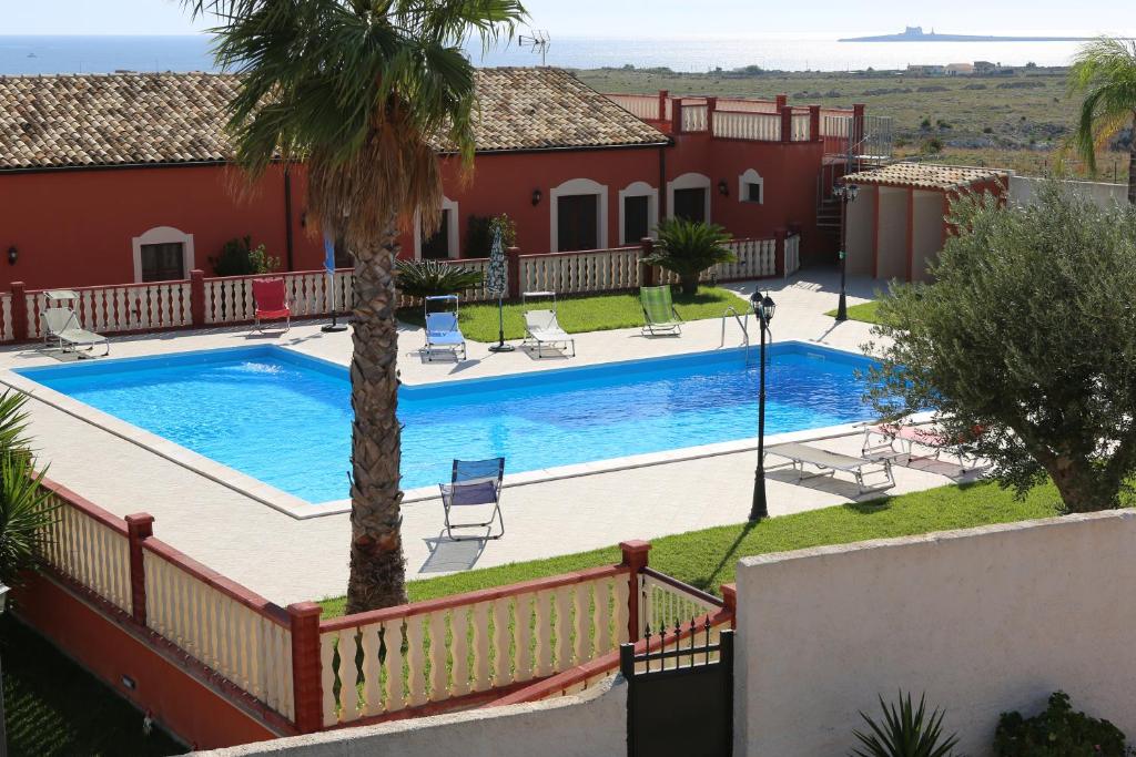 A view of the pool at Casa Vacanze Calafarina or nearby