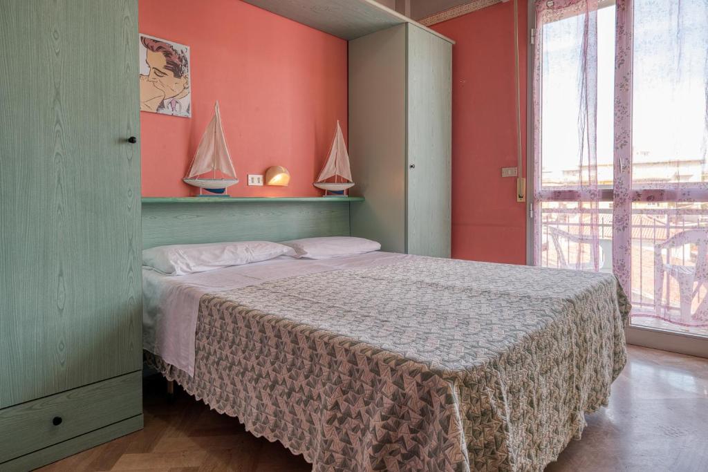 Postel nebo postele na pokoji v ubytování Hotel Sabbia d'Oro
