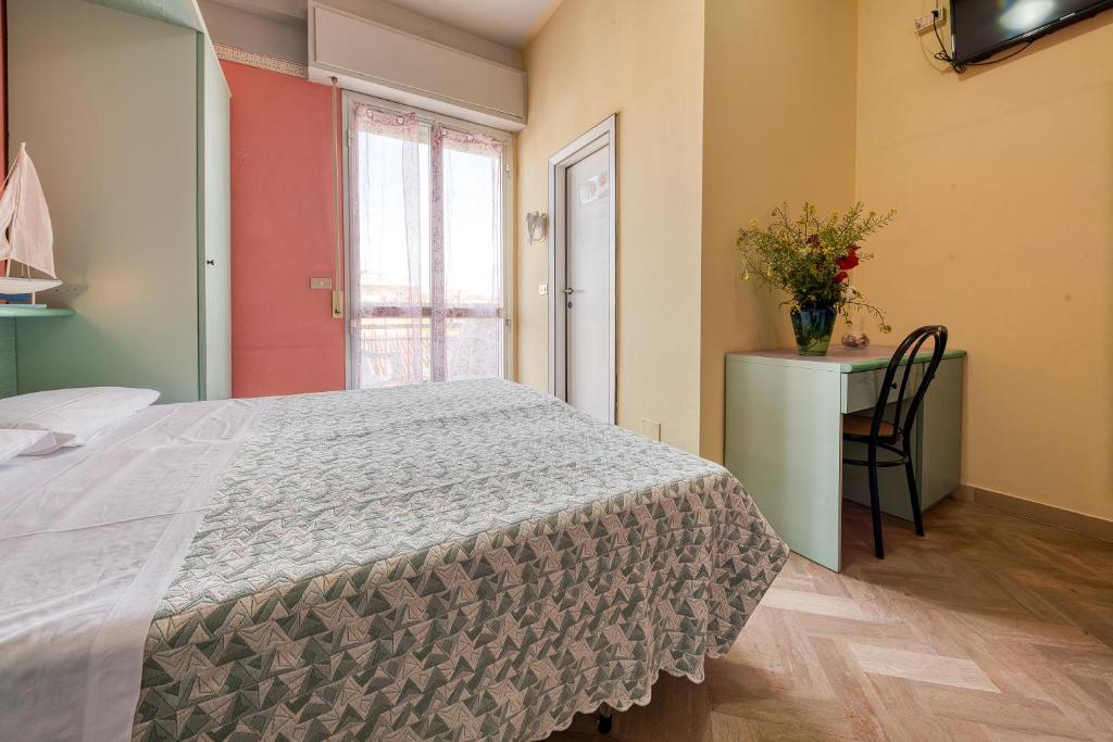 Postel nebo postele na pokoji v ubytování Hotel Sabbia d'Oro