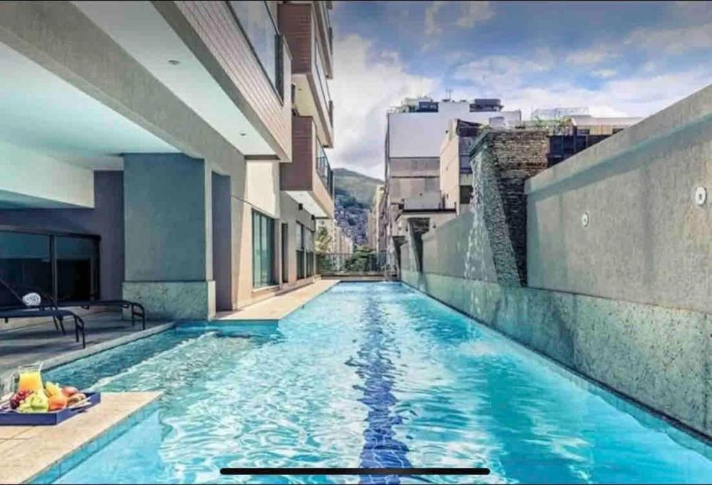 a swimming pool in the middle of a building at Premium Copacabana - Rio de Janeiro in Rio de Janeiro