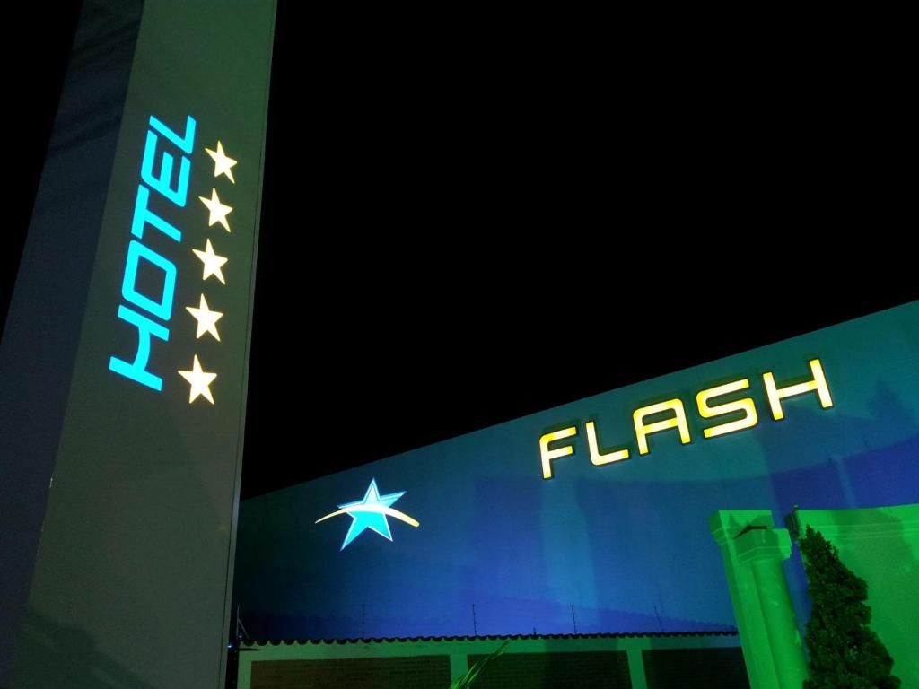 a sign for a fllash store with stars on it at Flash Motel (Adult Only) in São Vicente