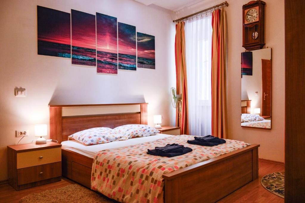 a bedroom with a bed with two towels on it at Charming marine style apartment in Cres