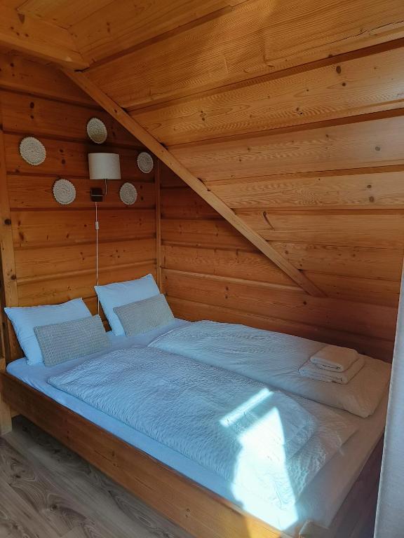 Posteľ alebo postele v izbe v ubytovaní Chata u Wozniaka