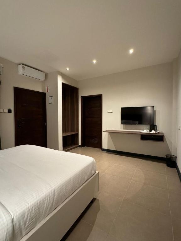TV a/nebo společenská místnost v ubytování The Ivory Hotel