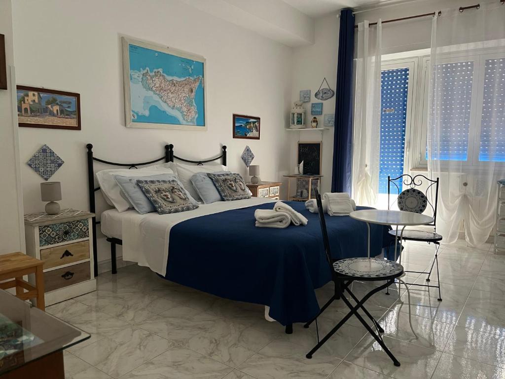 Postel nebo postele na pokoji v ubytování Eder Home A un passo dal Teatro Greco