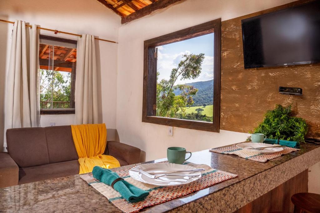 TV a/nebo společenská místnost v ubytování Chale brilho das estrelas em São Thomé das Letras-MG