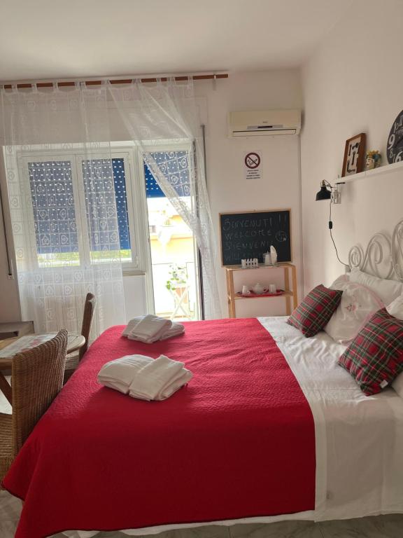 Postel nebo postele na pokoji v ubytování Eder Home A un passo dal Teatro Greco