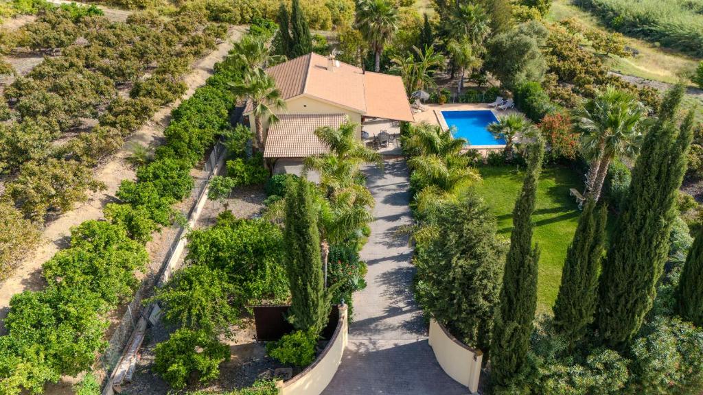 an aerial view of a house with trees and a swimming pool at Finca La Panorámica in Alhaurín el Grande