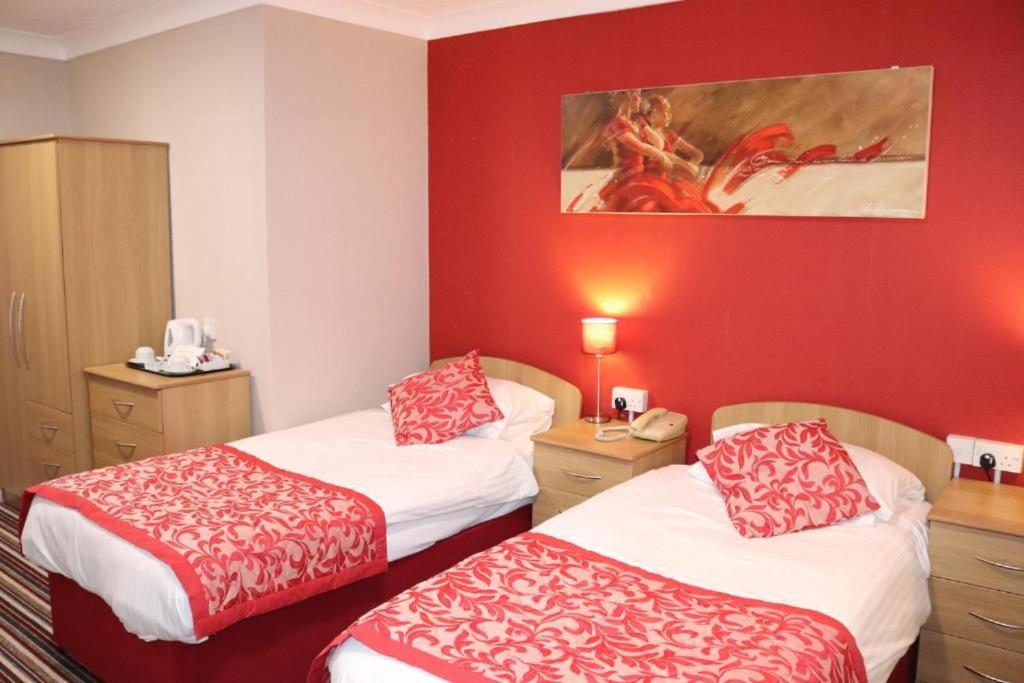 Postelja oz. postelje v sobi nastanitve Bournemouth Sands Hotel