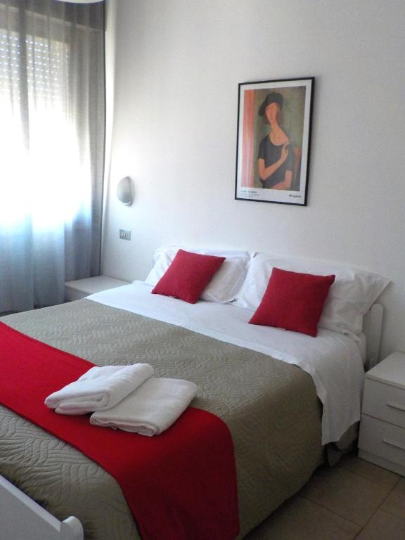 Postel nebo postele na pokoji v ubytování Hotel Migani